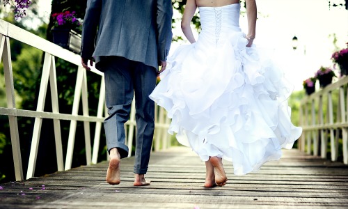 bride and groom on dock